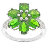 Oval green chrome diopside sterling silver ring with accent stones in a floral design.